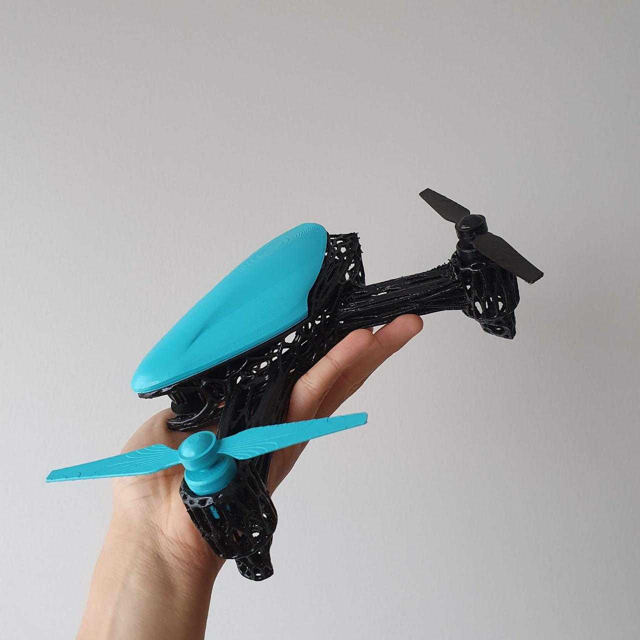 Picture of a drone held in a hand